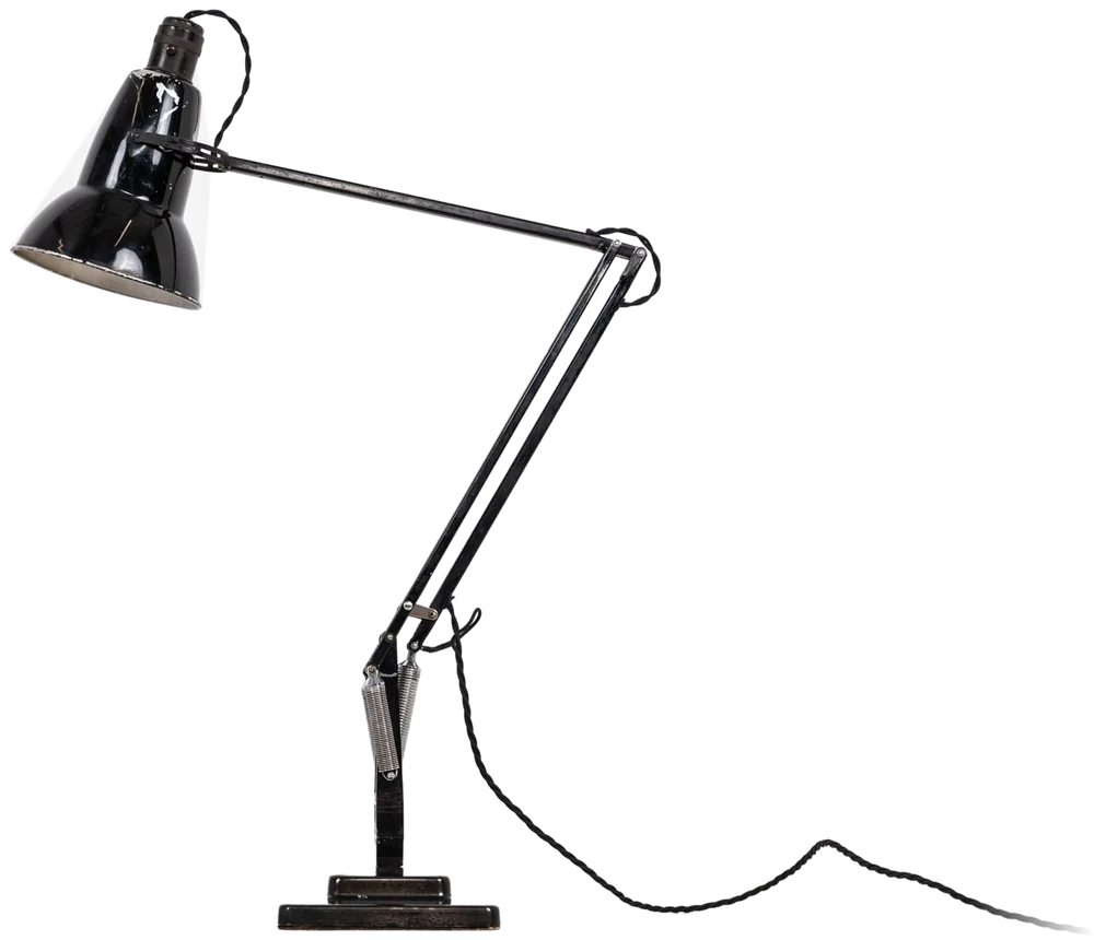 A vintage black anglepoise desk lamp angled towards the headline